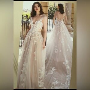 Beautiful never worn, never altered wedding dress.Bought off the rack.